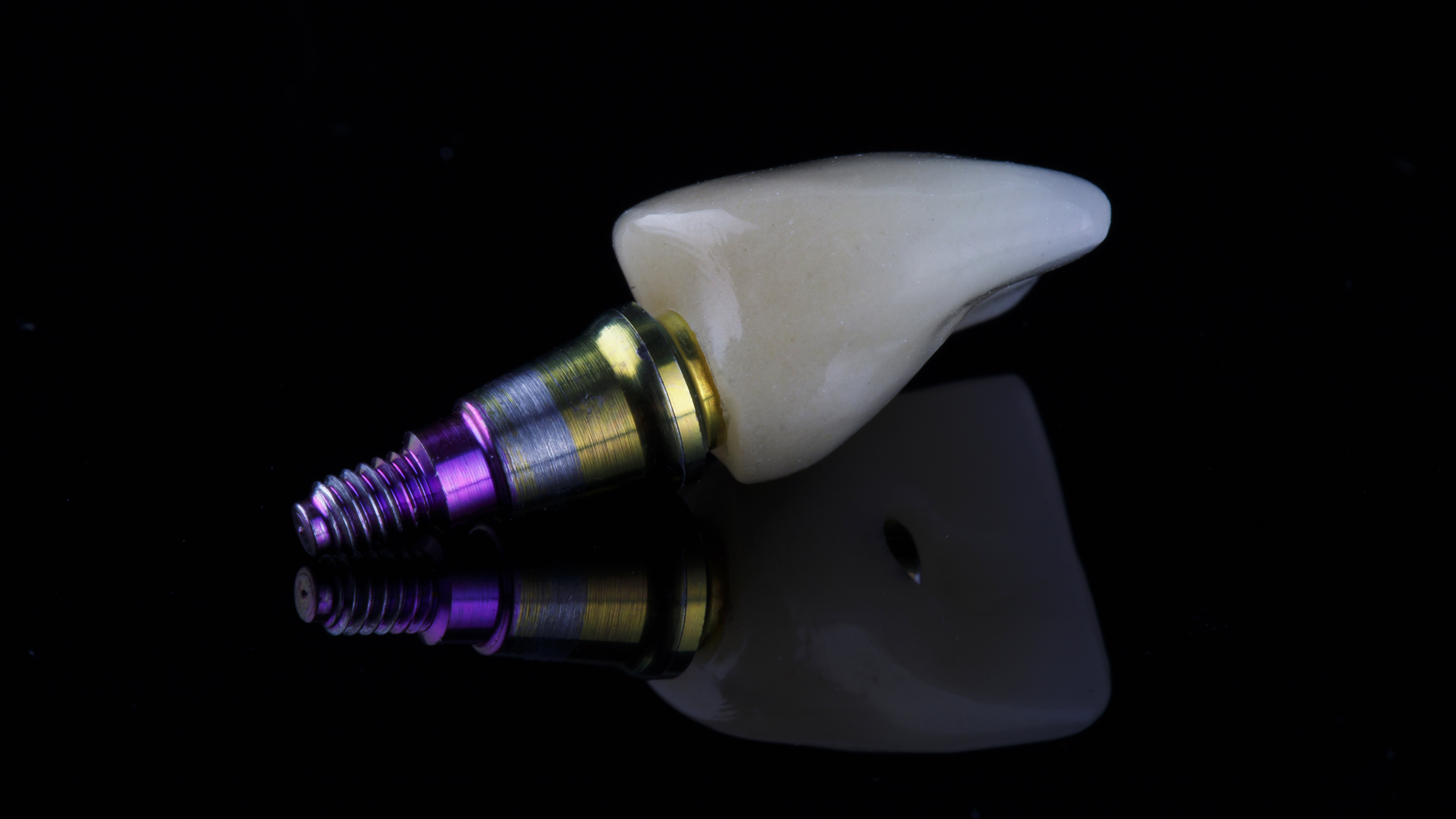 ideal dental crown and special abutment, shot on a black background